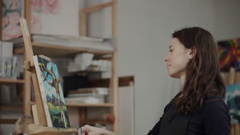 woman painting in an art studio