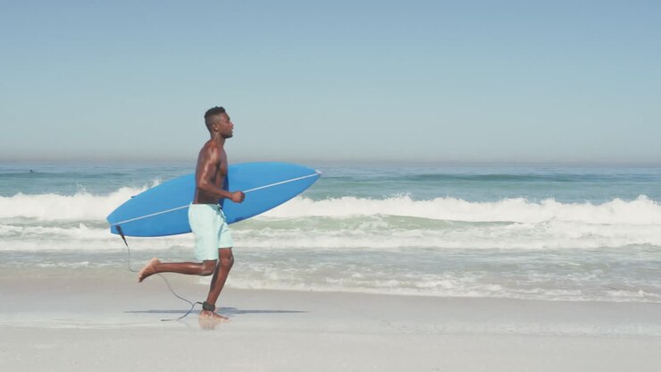 African American man ready to go surf