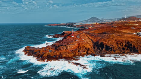 gran canaria coastal view featuring a lighthouse and rugged shore