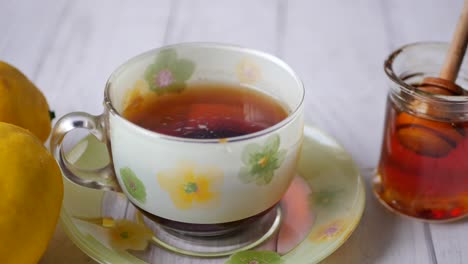 Close-up-of-dry-lemon,-ginger-and-green-tea-on-table