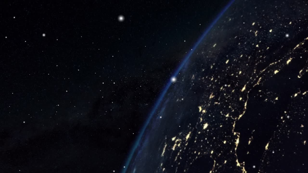 punto de vista, la superficie de la tierra por la noche desde el espacio exterior que está salpicada de estrellas