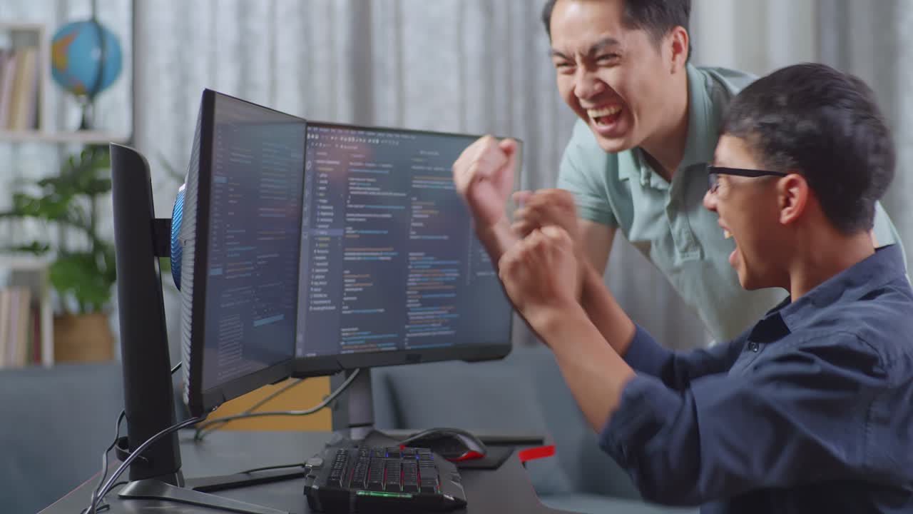 Two men celebrating a coding success