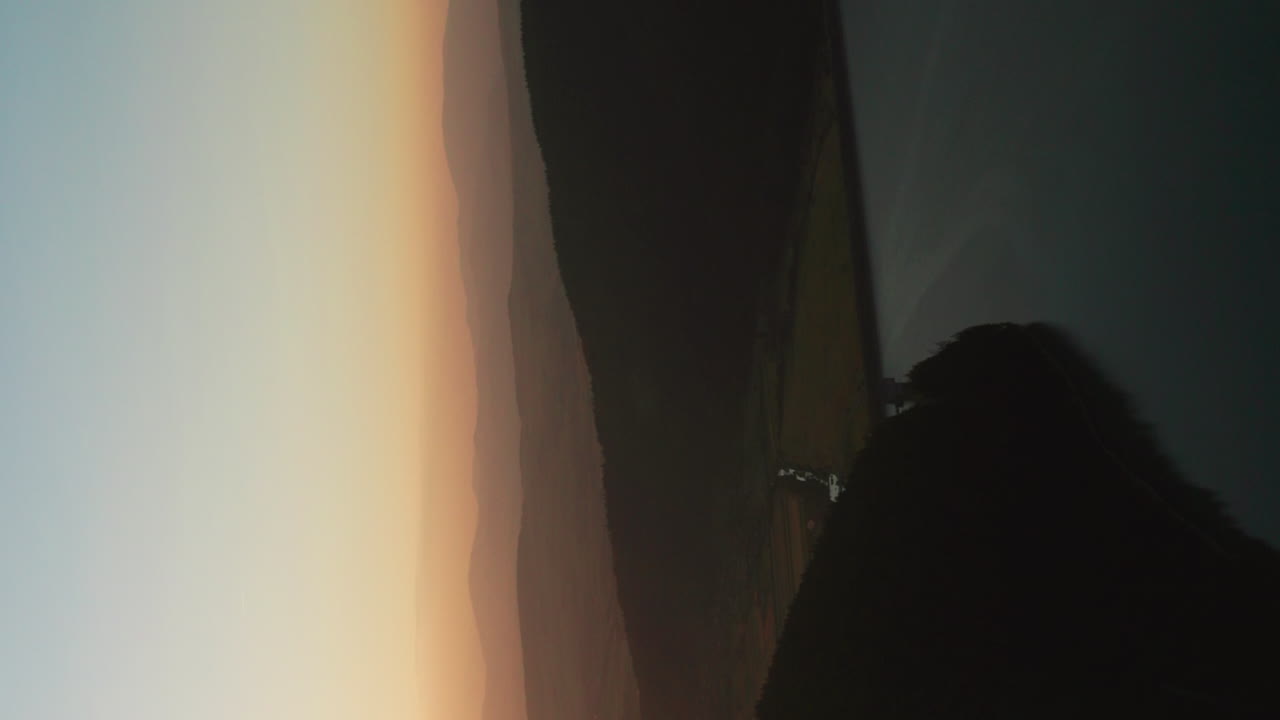 Vertical flyover above Frumoasa Dam, Romania at sunset