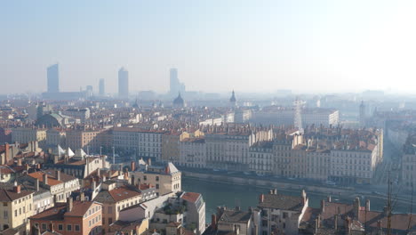 foggy morning view of vieux lyon by the rhone river and the skyline in france