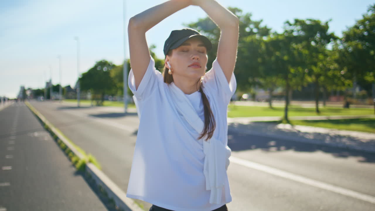 Tired runner walking road relaxing after jogging summer morning closeup