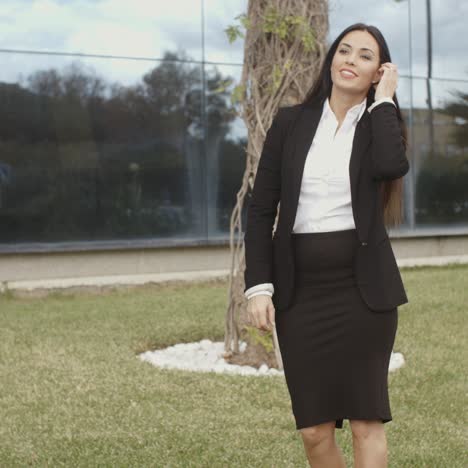 young professional woman standing waiting