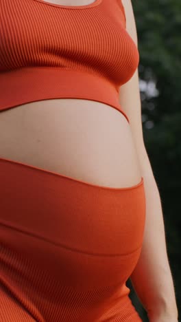 pregnant woman in orange top