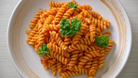 spiral-or-spirali-pasta-with-tomato-sauce-and-parsley---Italian-food-style