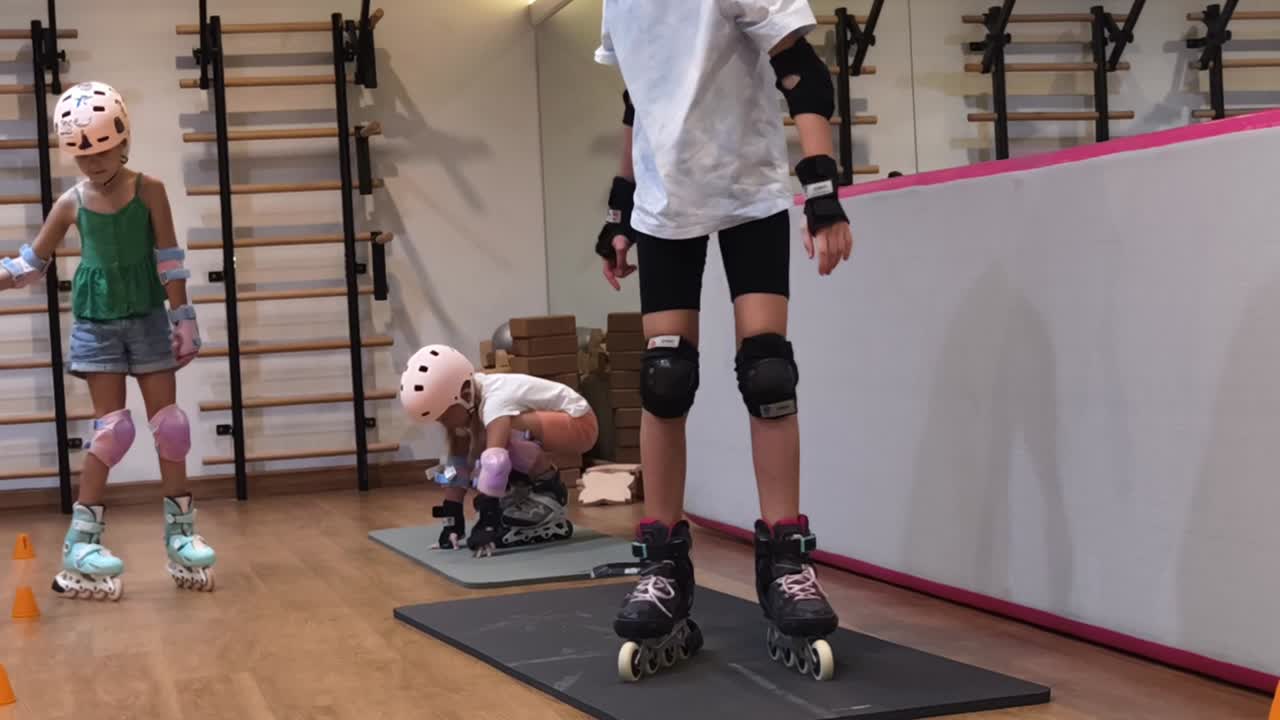 Children learning to roller skate