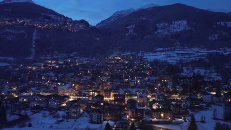 the roads are magical, but seen by a drone over the mountain with illuminated lights show the beauty of the olympic site in italy cortina 2026. mountains of love