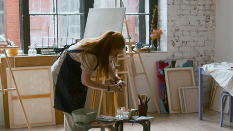 artist painting on a canvas