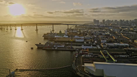 san diego california aerial v98 low flyover indian point capturing ship building and repair sites with coronado bridge and cityscape view at sunset - shot with mavic 3 cine - september 2022