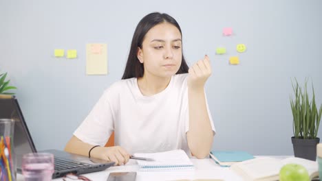 Female-student-stressed-and-biting-her-nails.