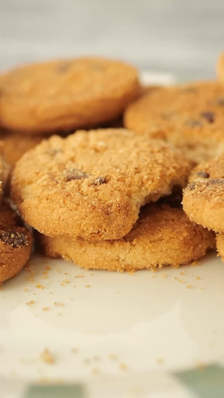 Hand Picking Up a Delicious Cookie from a Plate