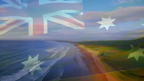 digital composition of australia flag waving against aerial view of waves in the sea