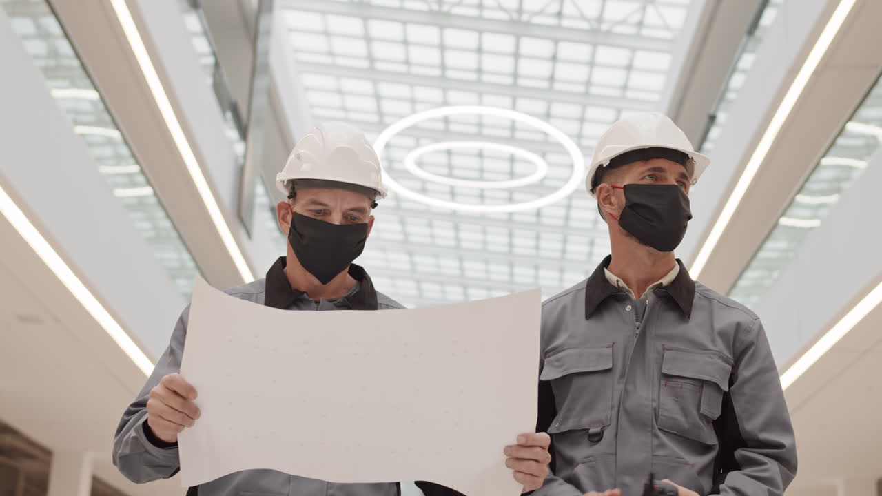 Constructors Wearing Masks Walking in Building
