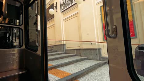 man boards cable car at naples station