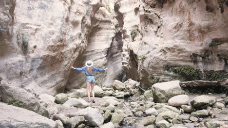 woman exploring a canyon