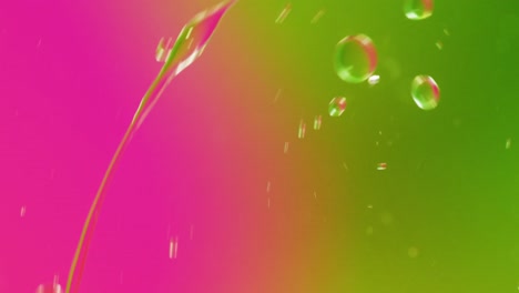 Animation-of-bubbles-moving-on-pink-and-green-background-with-copy-space