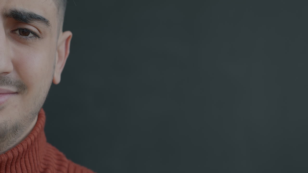 Close-up of a man wearing a red sweater