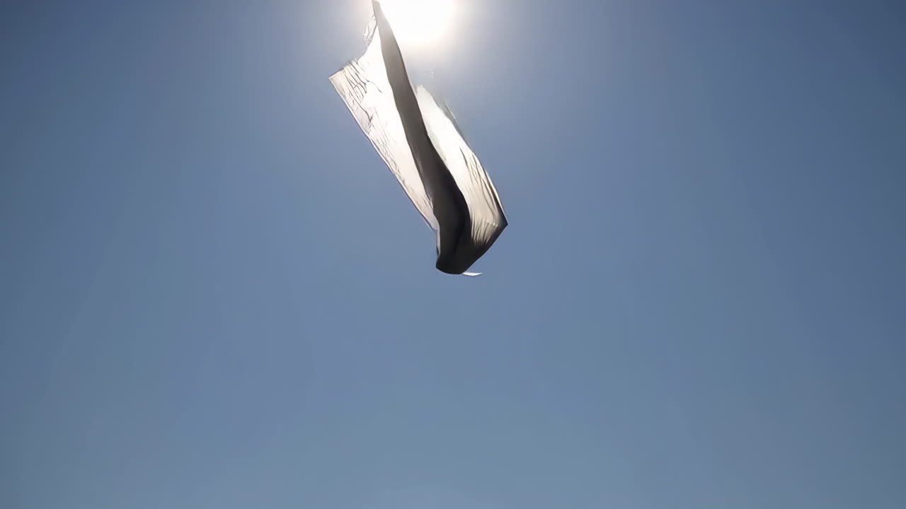 White Flag Flying in the Blue Sky