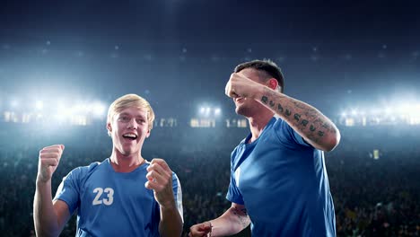 happy soccer player on a football stadium