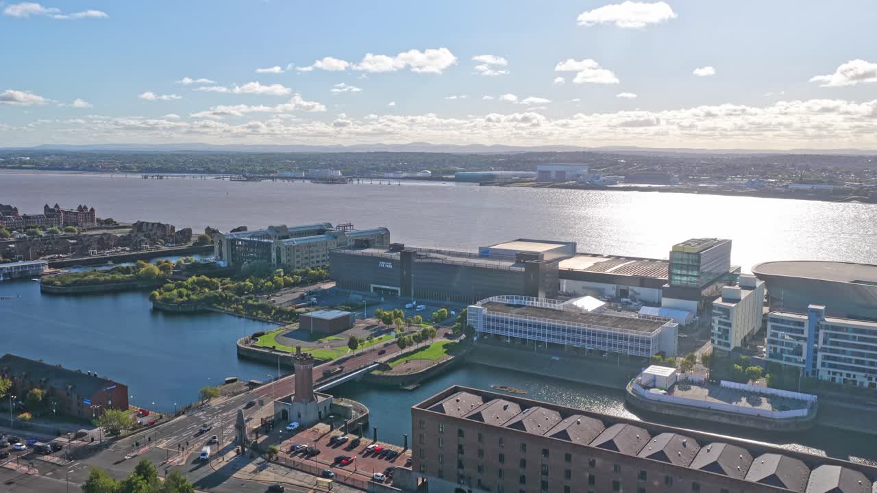 Stunning cinematic drone footage of Liverpool City Centre in northwest England, filmed during sunset. In the video you can see the Exhibition Centre and The Queens Wharf