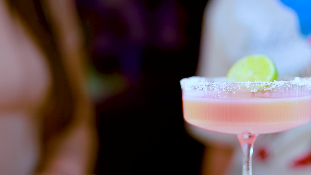 A lively scene with colorful cocktails, highlighting a festive atmosphere with dynamic lighting and close-up shots