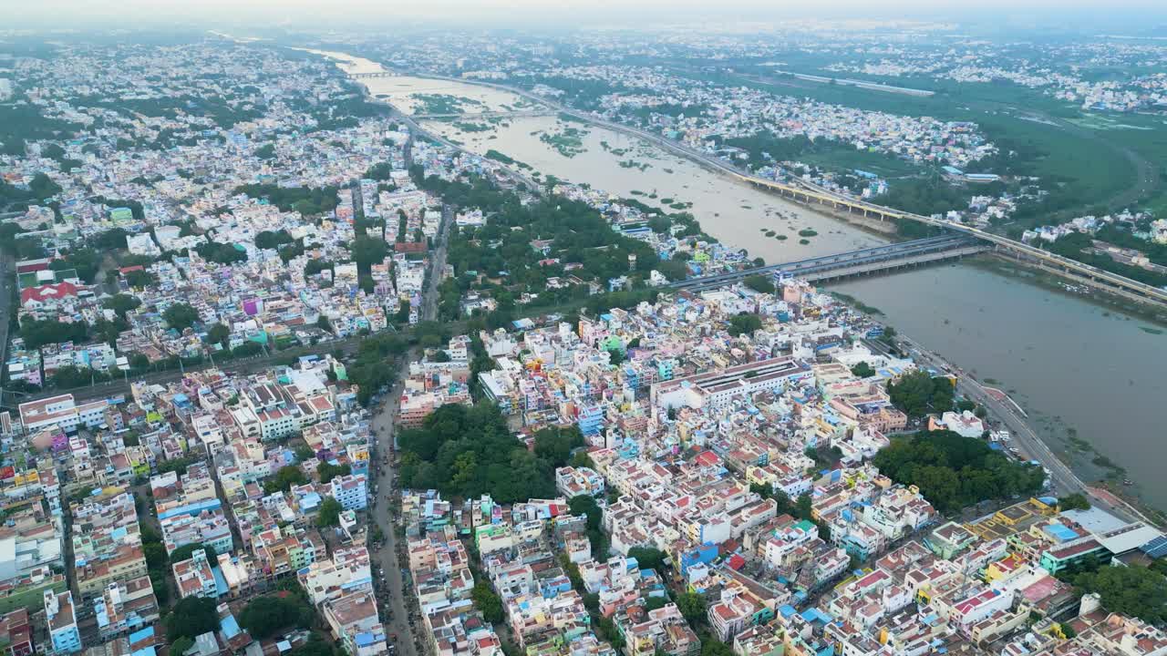 Vaigai river divides city of Madurai in Tamil Nadu India with dense urban buildings and homes