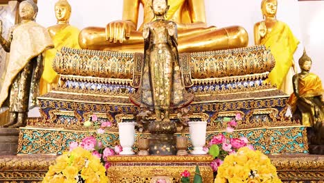 golden buddha statues with floral decorations