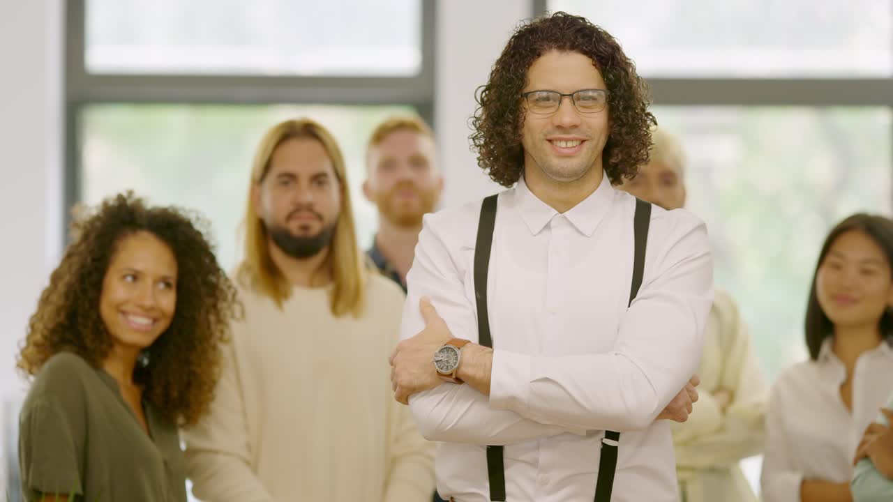 Man standing in front of his work team