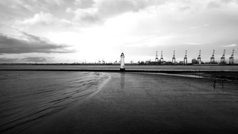 new brighton perch rock lighthouse, river mersey, wirral - aerial drone low approach, liverpool waterfront backdrop on a sunny winter afternoon 08