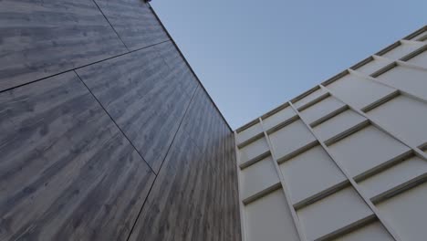 elegant building with textured facade under clear blue sky