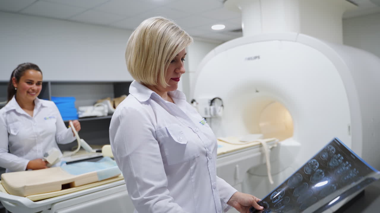 Medical Professionals Reviewing X-Ray/MRI Scans