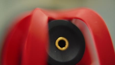 macro shot of a shotgun microphone, pl input, red mic back side, camera gear, sound record equipment, slow motion 120 fps, full hd, tilt down smooth movement