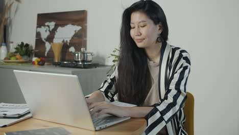woman working from home on laptop