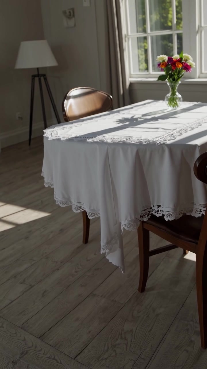 Time Lapse of Sunlight and Shadows on a White Lace Tablecloth with Flowers