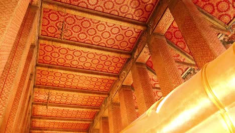 golden buddha statue in ornate temple setting