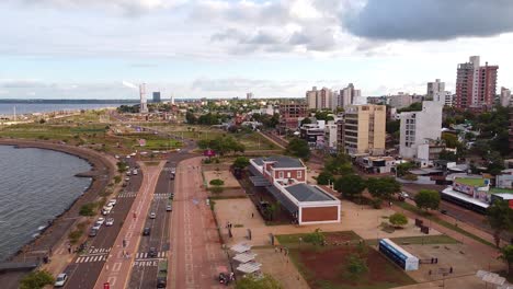 Aerial-view-of-the-city,-highway-in-front-of-the-river-in-Posadas,-Misiones,-Argentina