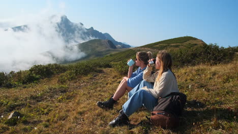 two women enjoying a mountain view