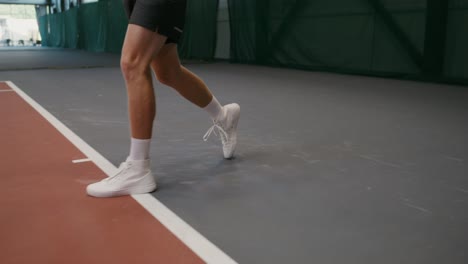 tennis player in indoor court