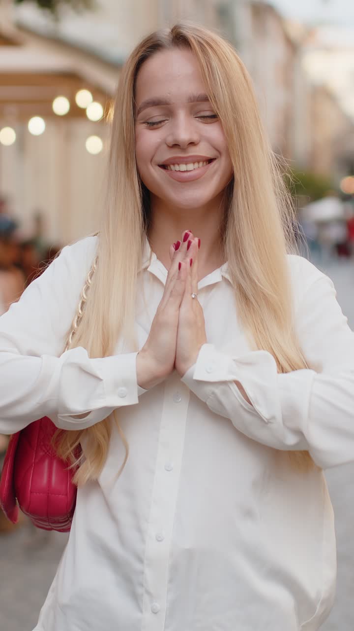 Young woman shouting celebrating success winning goal achievement good victory news in city street