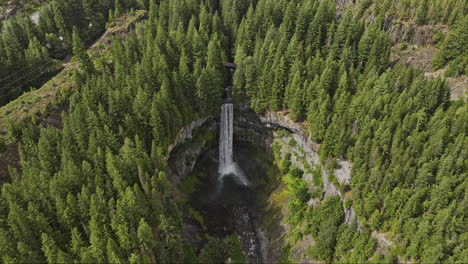 brandywine falls bc canada aerial v7 slow motion birds eye view drone flyover provincial park capturing spectacular waterfalls cascading into deep rocky canyon - shot with mavic 3 pro cine - july 2023