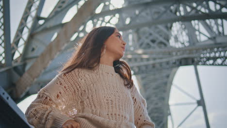 city woman looking distance in urban construction closeup.  model posing