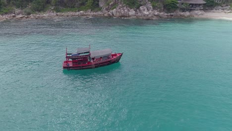 red boat on the water