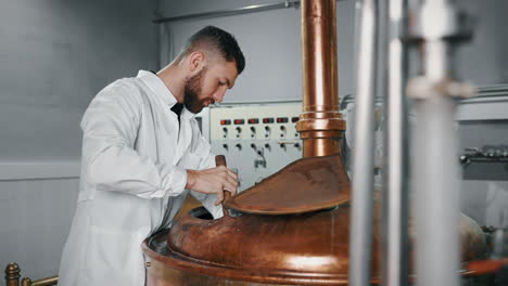 brewery worker operating equipment