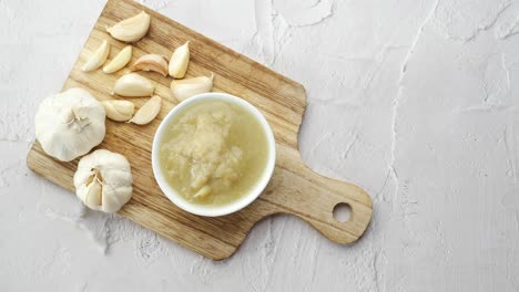 garlic paste preparation: a close-up view of minced garlic in a bowl