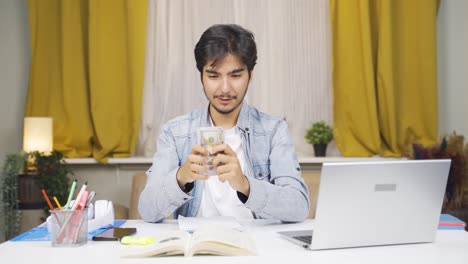 happy male student earning money.