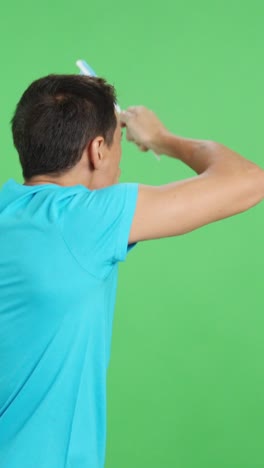 rear view of a man waving a argentine pennant