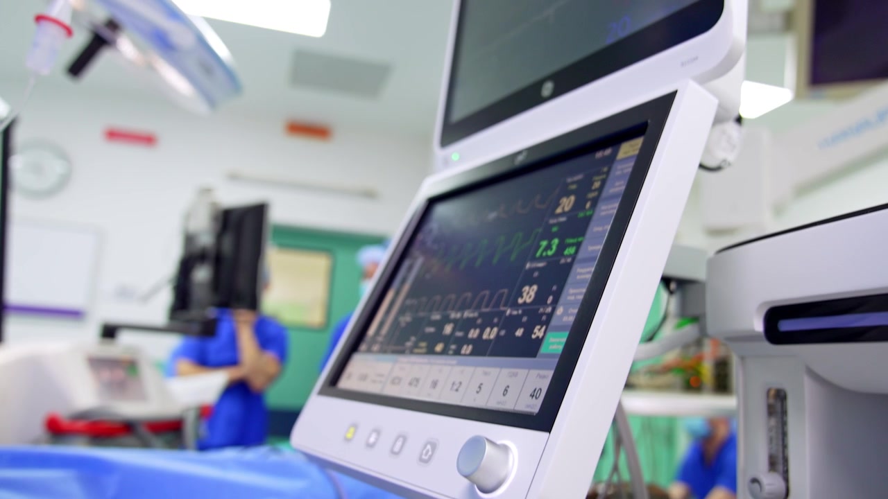Infusion pumps and lung ventilator in surgery room. Medical equipment in modern hospital.